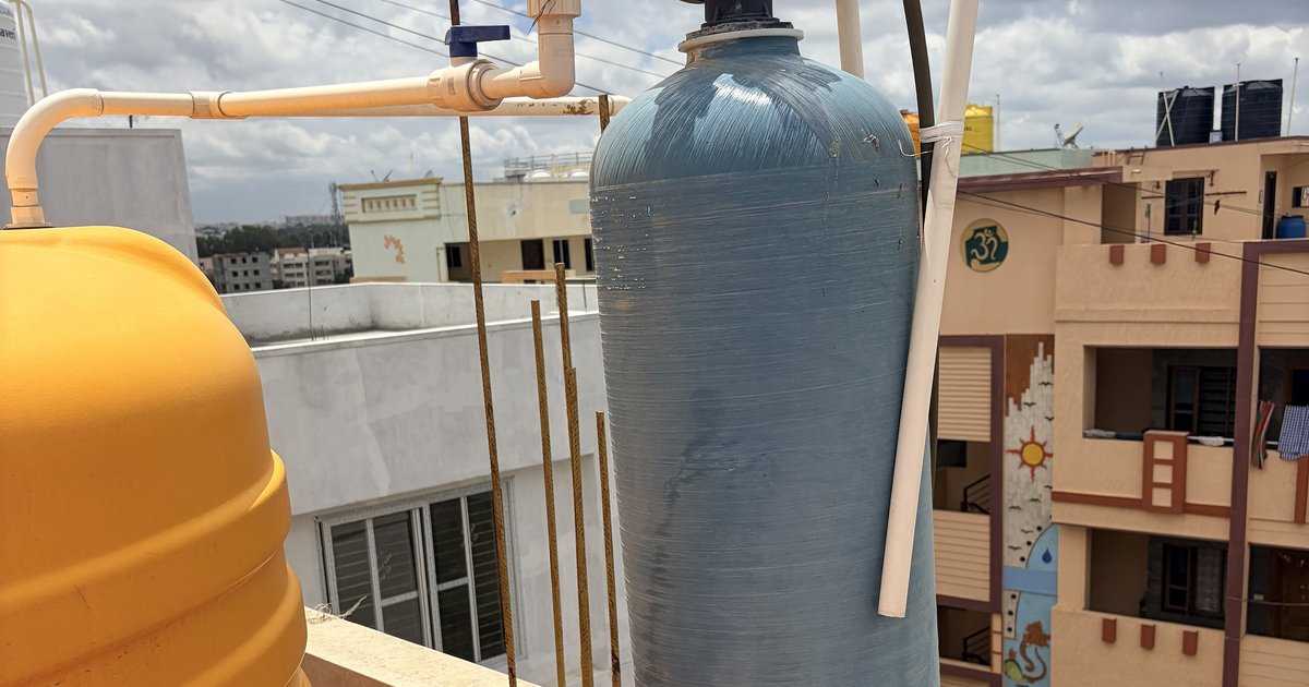 A residential water softener and brine tank installed in a Central Florida garage