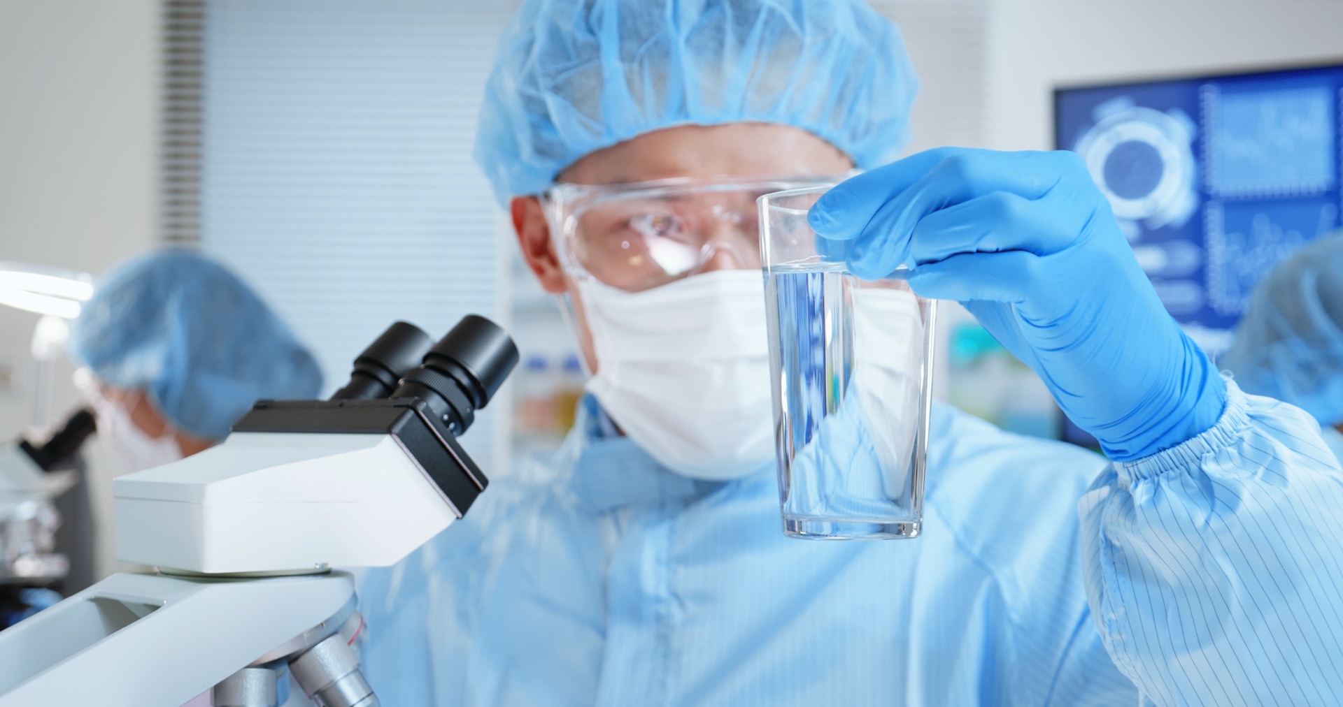 Technician testing water quality in lab