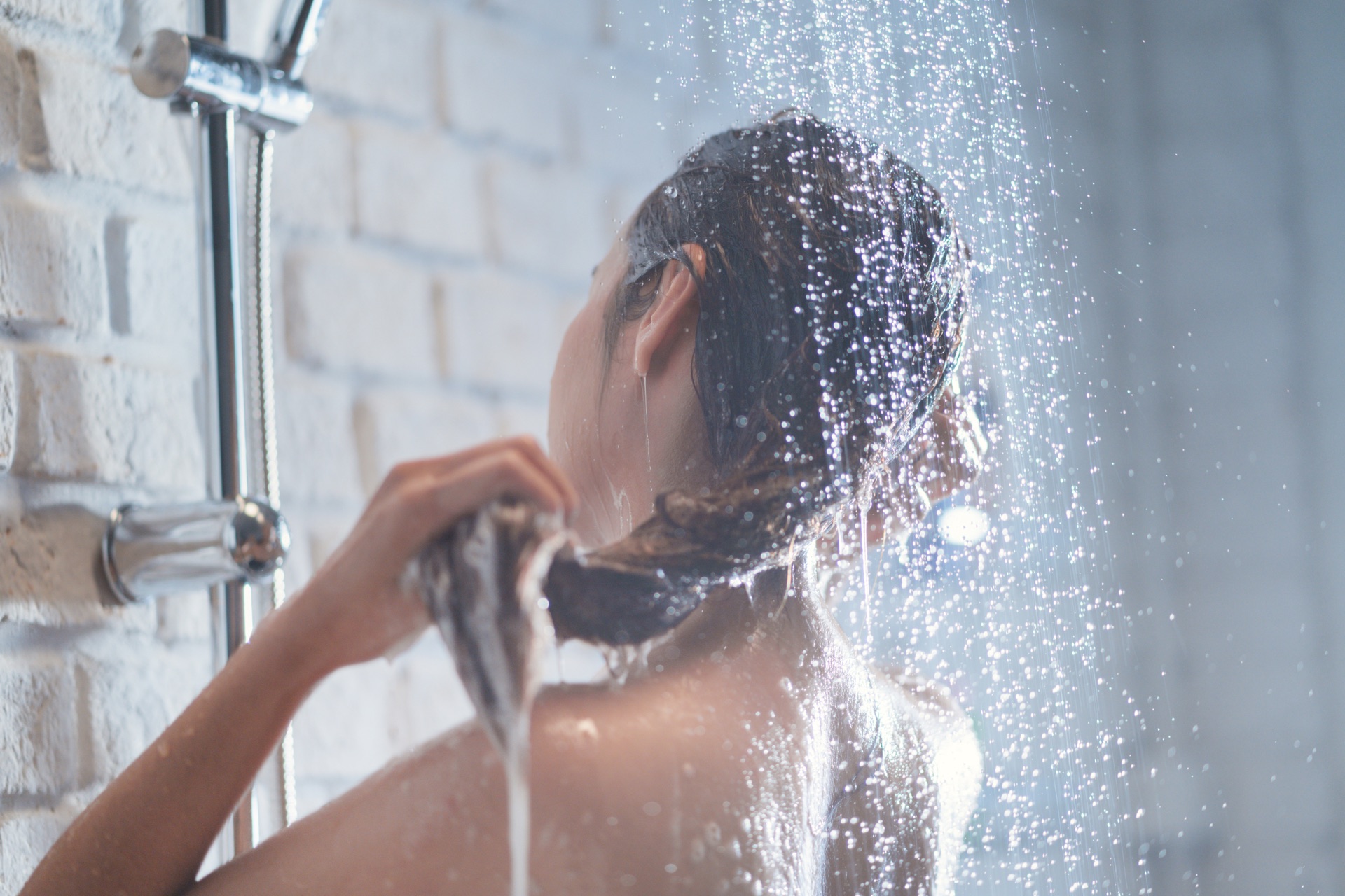 Woman enjoying clean filtered shower water